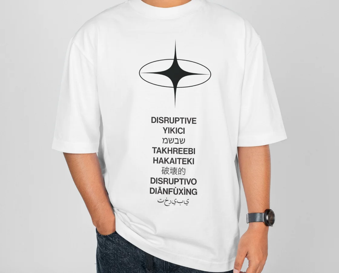 Disruptive Ltd design agency showcasing bespoke production with multilingual branded apparel mockup